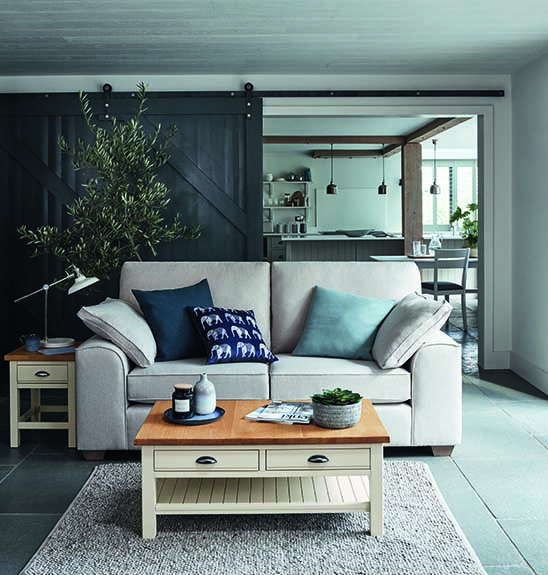 A sofa inside a rustic home